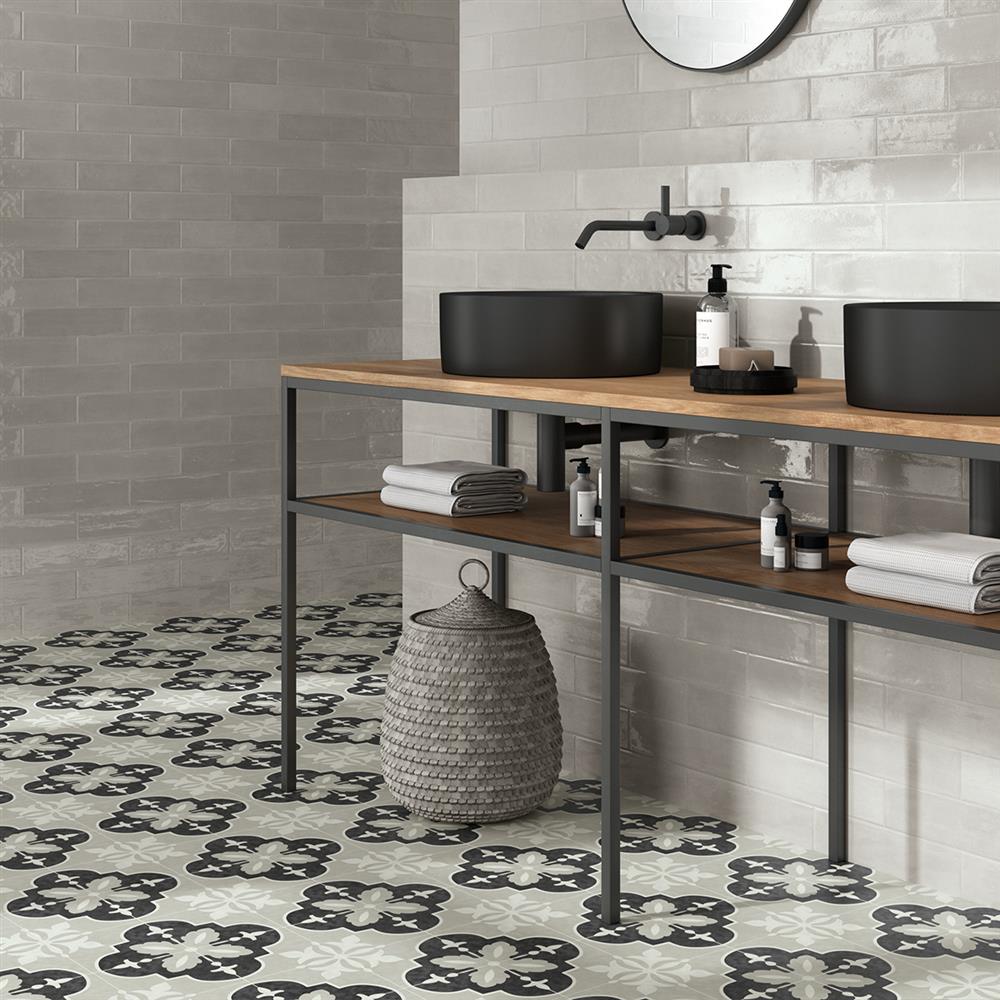 Victorian grey patterned tiles with matching grey metro wall tiles in a bathroom